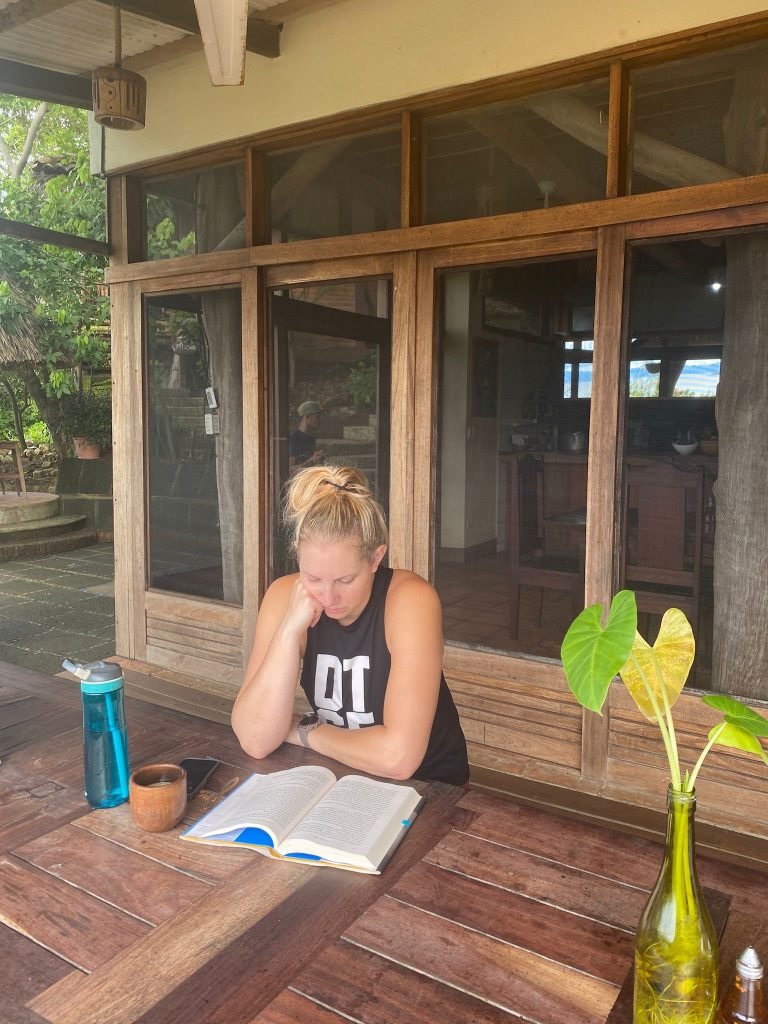 Woman reading solo at Costa Dulce wellness retreat in Nicaragua