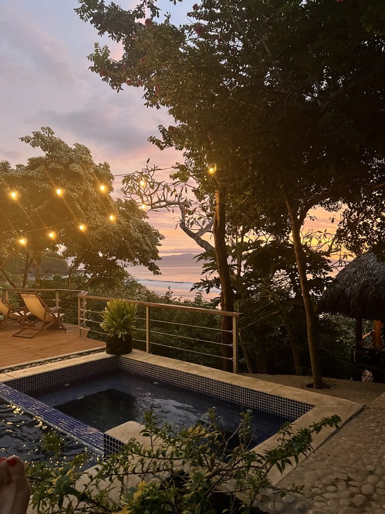 Golden hour shot of the pool and ocean view at Costa Dulce in Nicaragua