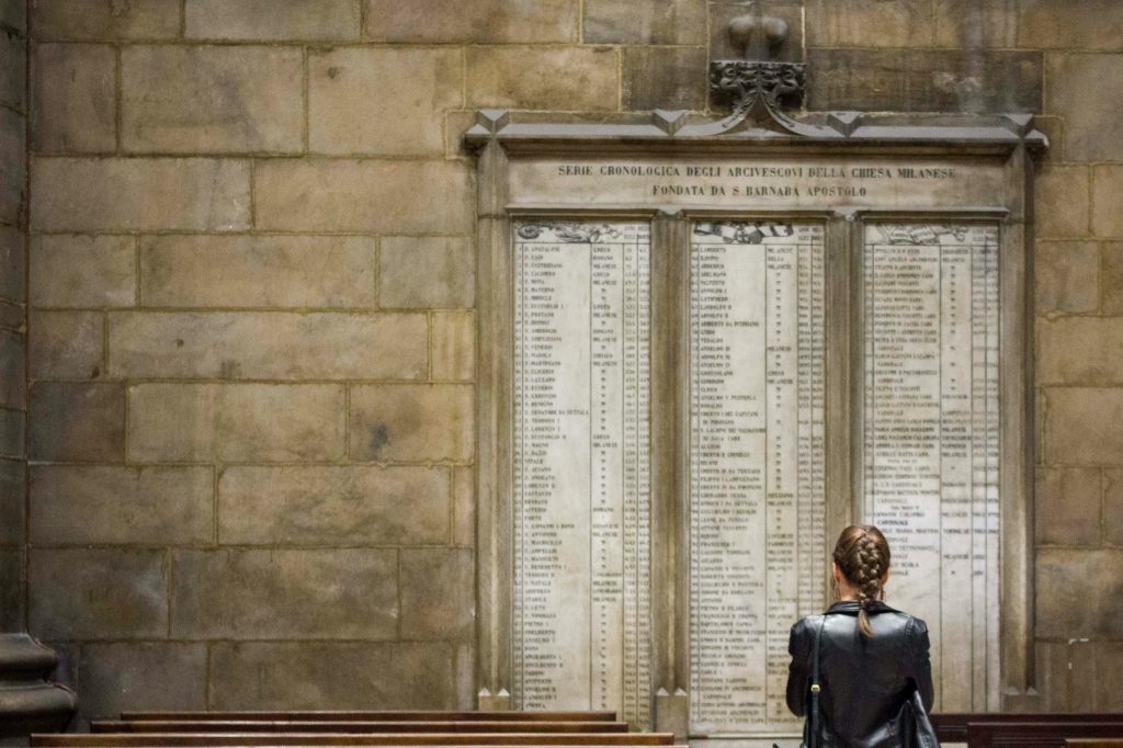 Woman in front of long list