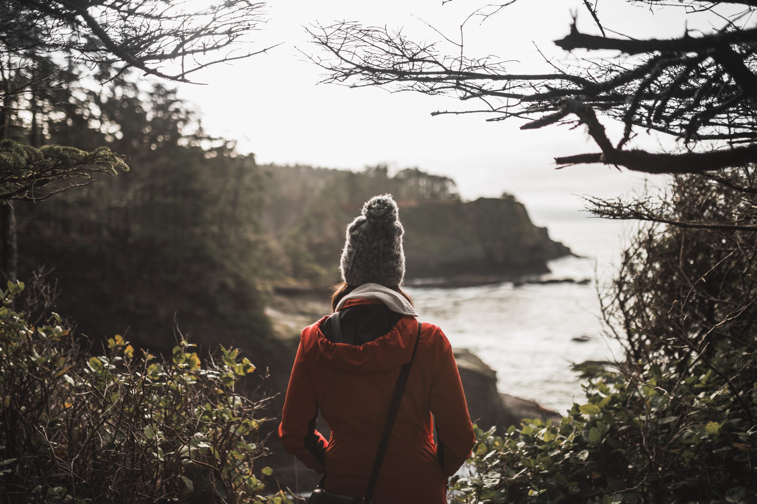 Woman admiring a beautiful lake and nature view